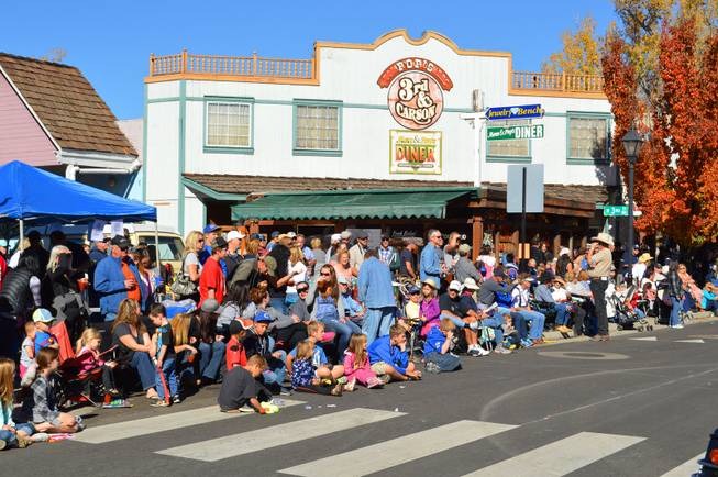 People line Carson Avenue in Carson City on Saturday, Oct. 26, 2013, for the 75th annual Nevada Day parade.